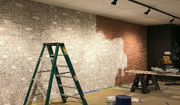 garage accent wall with exposed brick