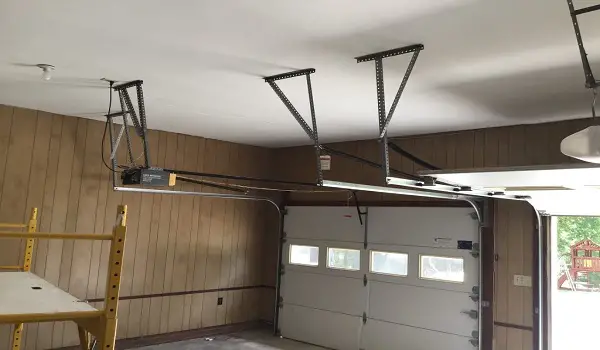 garage accent wall with popcorn ceiling