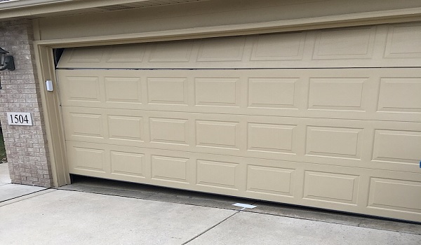 garage door shifted to one side when opening