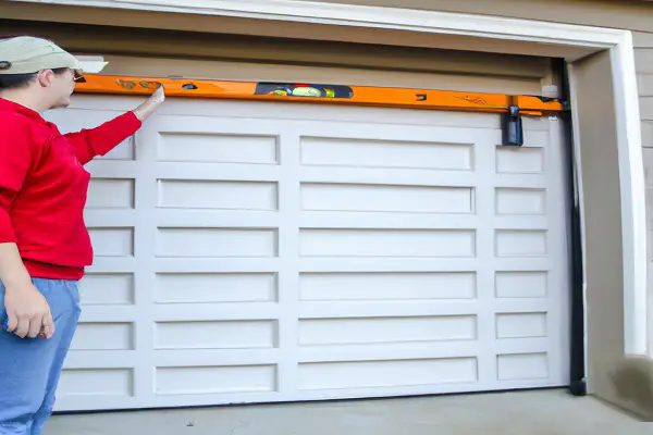 how to level a garage door Assess the Problem