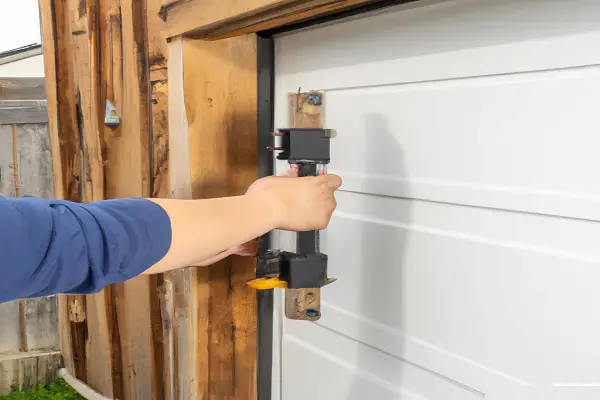 how to level a garage door adjust the hinges
