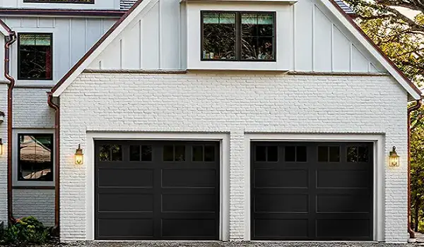 Single door black garage door white house