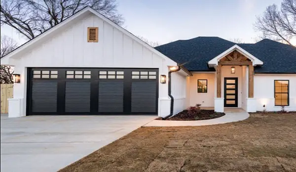 contrasting accents black garage door white house