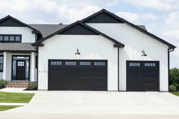white house with black garage