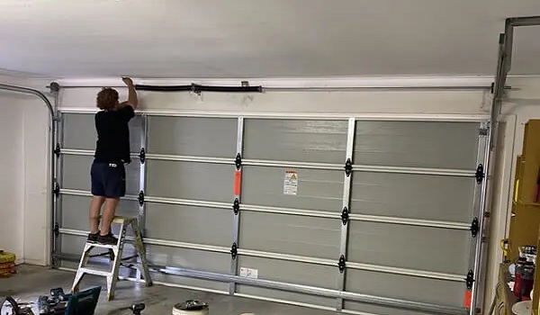 how to fix a garage door that only opens a foot