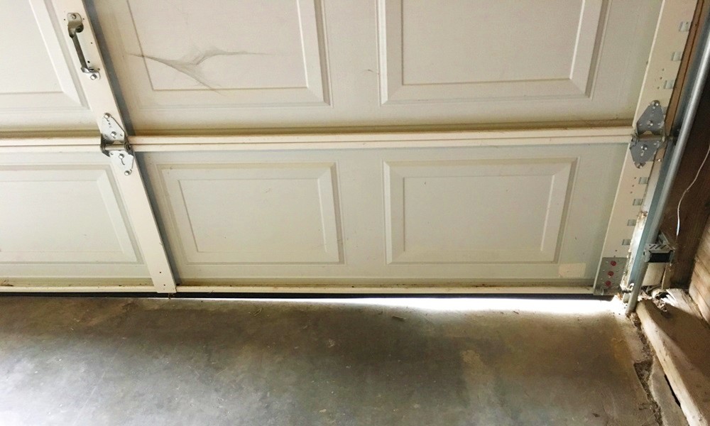 how to fix garage door gap